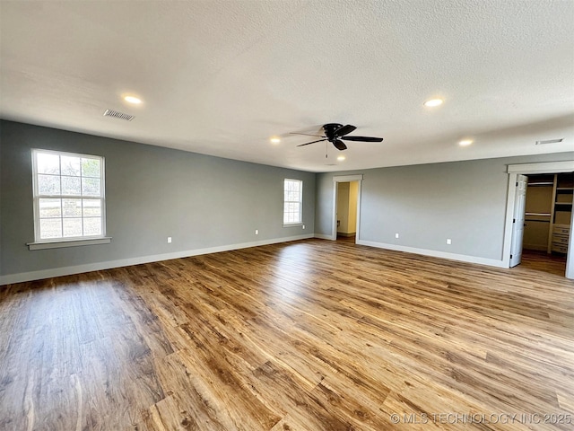 17022 S 579th Rd, Tahlequah, OK 74464 - spare room with wood finished floors, a textured ceiling, ceiling fan, and recessed lighting