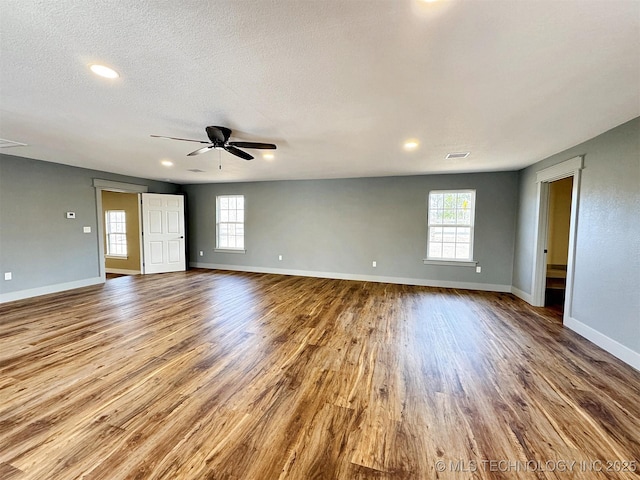 17022 S 579th Rd, Tahlequah, OK 74464 - empty room with wood finished floors, a ceiling fan, and recessed lighting
