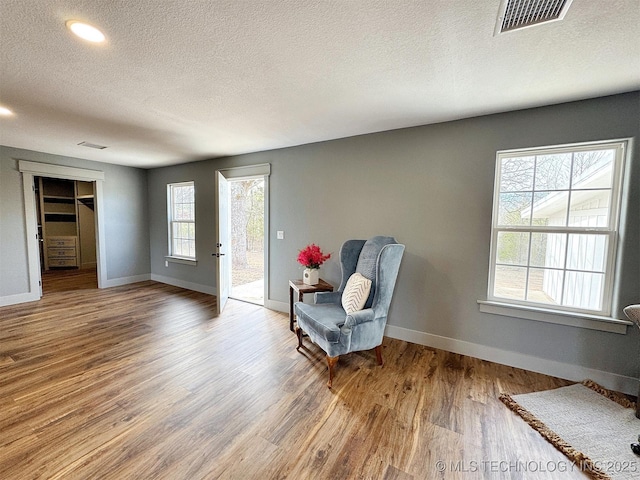 17022 S 579th Rd, Tahlequah, OK 74464 - living area featuring a textured ceiling, wood finished floors, and recessed lighting