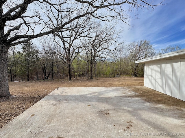 17022 S 579th Rd, Tahlequah, OK 74464 - view of yard featuring a patio and a wooded view