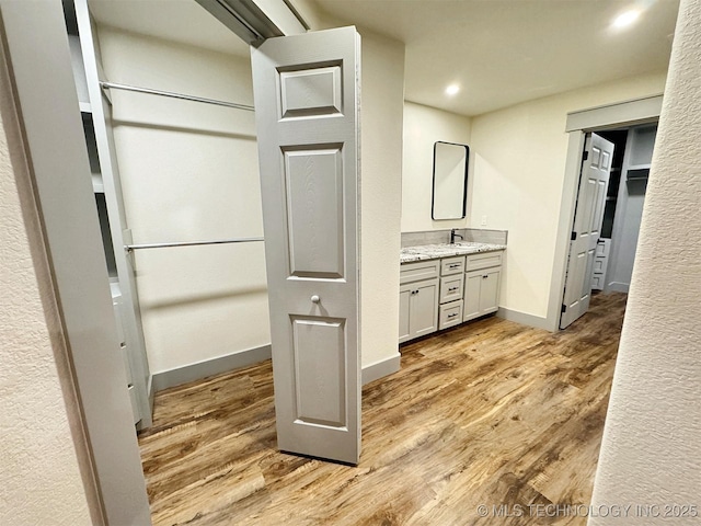 17022 S 579th Rd, Tahlequah, OK 74464 - bathroom with vanity, wood finished floors, and recessed lighting