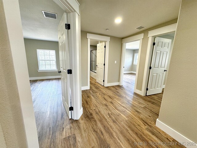 17022 S 579th Rd, Tahlequah, OK 74464 - corridor featuring wood finished floors and baseboards