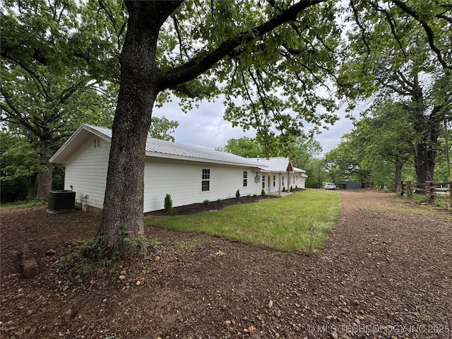 17022 S 579th Rd, Tahlequah, OK 74464 - view of property exterior with a metal roof and a lawn