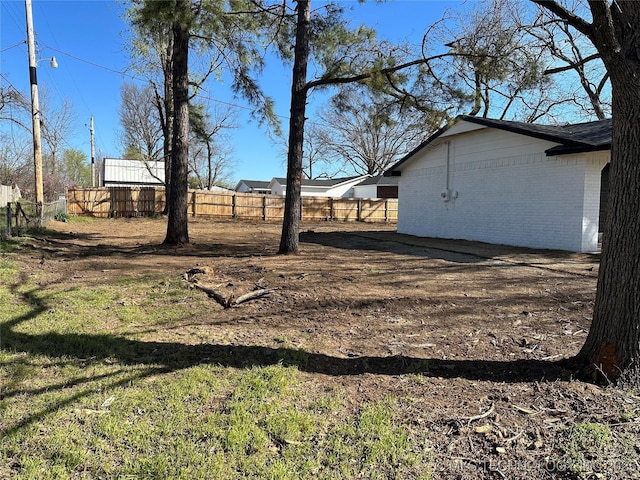 view of yard with fence