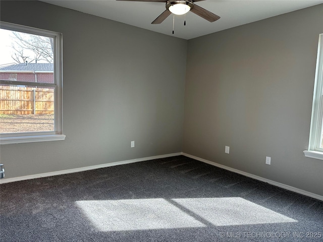 empty room with baseboards, carpet, and ceiling fan