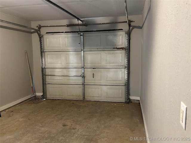 garage featuring baseboards
