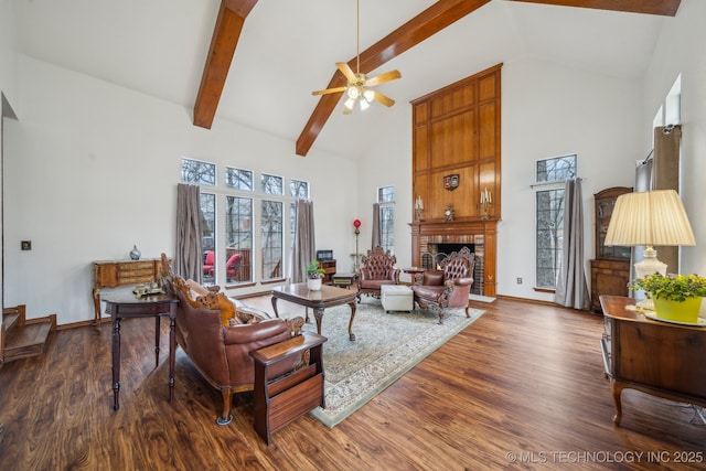 living room featuring wood finished floors, a ceiling fan, and high vaulted ceiling