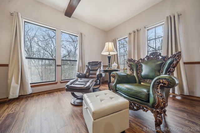 living area featuring wood finished floors and beam ceiling