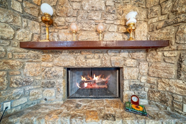 details featuring a stone fireplace