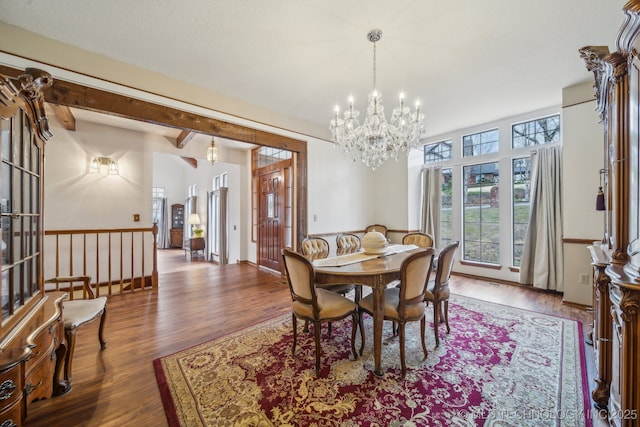 dining room with a notable chandelier and wood finished floors