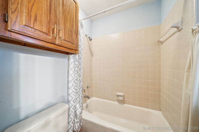 full bath featuring shower / tub combo and toilet