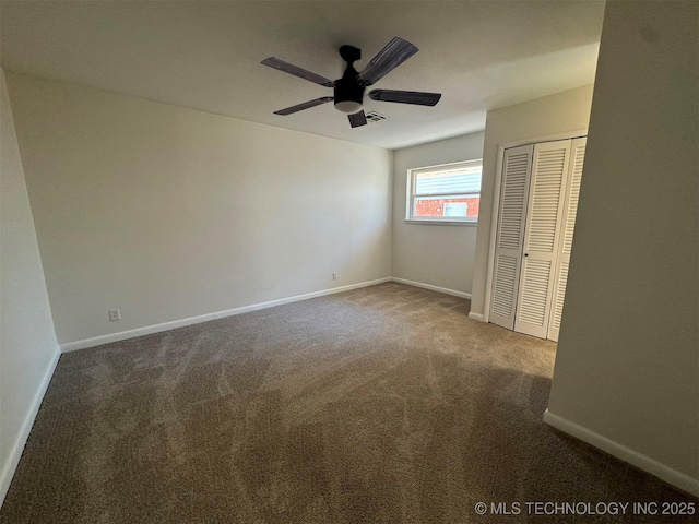 4760 S Irvington Ave, Tulsa, OK 74135 - unfurnished bedroom featuring visible vents, baseboards, carpet floors, ceiling fan, and a closet