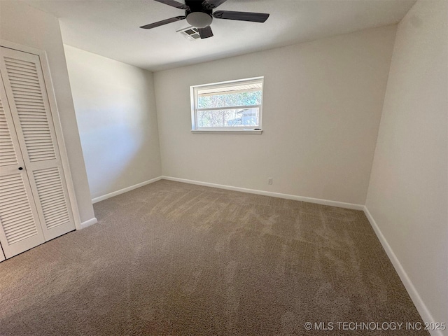 4760 S Irvington Ave, Tulsa, OK 74135 - unfurnished bedroom featuring visible vents, baseboards, carpet floors, a closet, and a ceiling fan