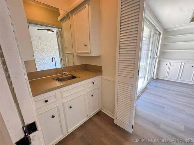 4760 S Irvington Ave, Tulsa, OK 74135 - kitchen with white cabinetry, dark wood-style flooring, and a sink