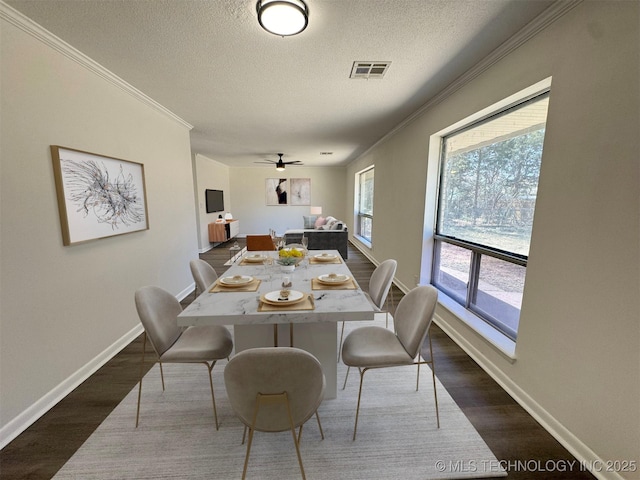 4760 S Irvington Ave, Tulsa, OK 74135 - dining area with visible vents, dark wood-style flooring, and crown molding