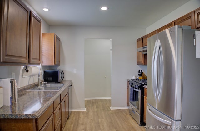 46 S 188th E Ave, Tulsa, OK 74108 - kitchen featuring a sink, recessed lighting, light wood-style floors, appliances with stainless steel finishes, and baseboards