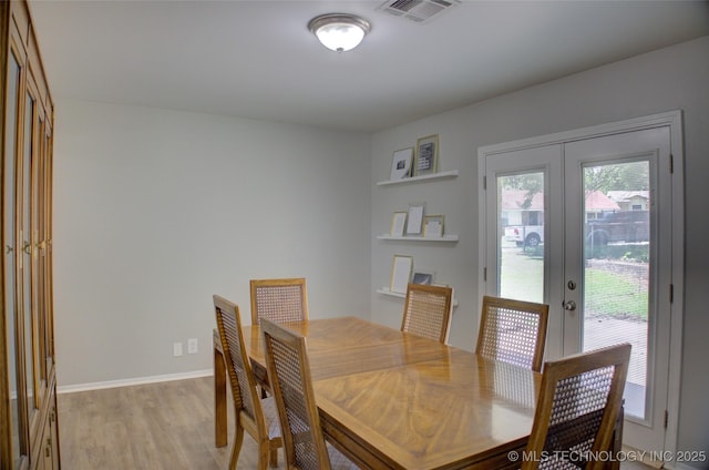 46 S 188th E Ave, Tulsa, OK 74108 - dining area featuring light wood finished floors, visible vents, french doors, and baseboards