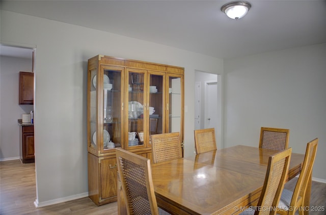 46 S 188th E Ave, Tulsa, OK 74108 - dining area featuring light wood-style flooring and baseboards