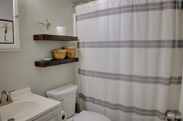 46 S 188th E Ave, Tulsa, OK 74108 - bathroom with a shower with shower curtain, toilet, and vanity