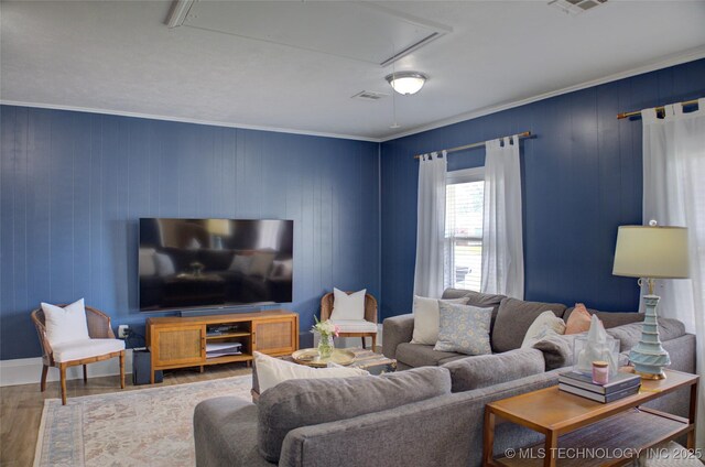 46 S 188th E Ave, Tulsa, OK 74108 - living area with visible vents, attic access, wood finished floors, and crown molding