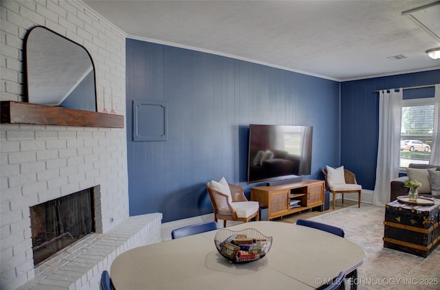 46 S 188th E Ave, Tulsa, OK 74108 - living area with a brick fireplace, baseboards, visible vents, and ornamental molding