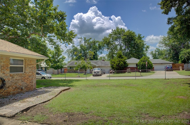 46 S 188th E Ave, Tulsa, OK 74108 - view of yard with a garage and fence