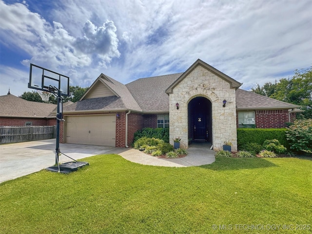661 Kingston Pl, Tahlequah, OK 74464 - view of front of home with driveway, brick siding, an attached garage, a shingled roof, and stone siding