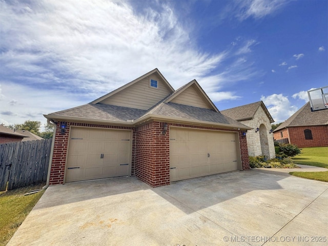 661 Kingston Pl, Tahlequah, OK 74464 - view of front of property with roof with shingles, an attached garage, brick siding, and concrete driveway