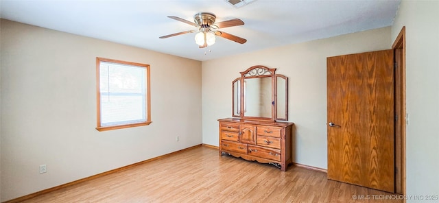 bedroom with baseboards, ceiling fan, and light wood finished floors