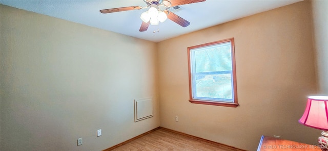 unfurnished room featuring ceiling fan, baseboards, visible vents, and light wood-type flooring