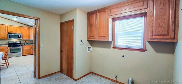 clothes washing area with baseboards, gas dryer hookup, hookup for an electric dryer, laundry area, and washer hookup