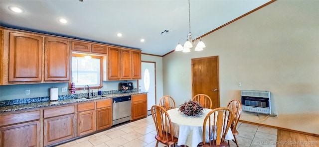 kitchen with heating unit, visible vents, dark stone counters, a sink, and stainless steel dishwasher