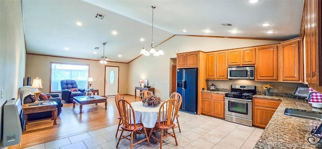 kitchen featuring visible vents, open floor plan, dark stone countertops, brown cabinets, and stainless steel appliances