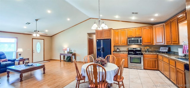 kitchen with visible vents, brown cabinets, appliances with stainless steel finishes, and ornamental molding