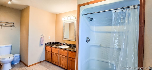 bathroom featuring curtained shower, baseboards, toilet, tile patterned floors, and vanity