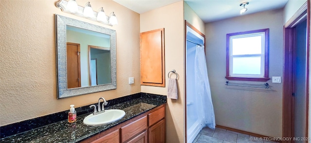 full bath featuring tile patterned flooring and vanity