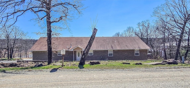 exterior space with brick siding