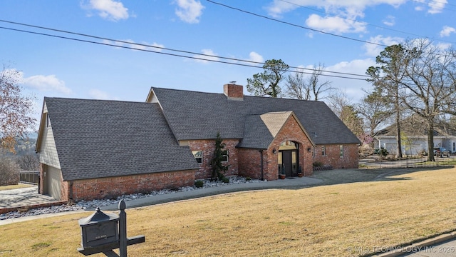 122 Osage Ridge Dr, Sand Springs, OK 74063 - view of front of property featuring a front lawn, brick siding, and a chimney