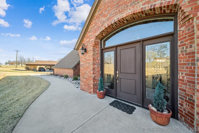 122 Osage Ridge Dr, Sand Springs, OK 74063 - doorway to property with brick siding