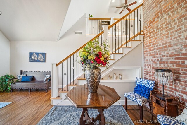 122 Osage Ridge Dr, Sand Springs, OK 74063 - stairway with visible vents, a high ceiling, ceiling fan, and wood finished floors