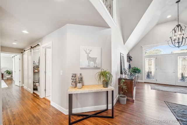 122 Osage Ridge Dr, Sand Springs, OK 74063 - foyer entrance featuring recessed lighting, a notable chandelier, wood finished floors, and baseboards