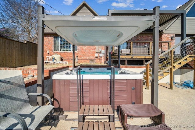 122 Osage Ridge Dr, Sand Springs, OK 74063 - view of patio / terrace with fence and a hot tub