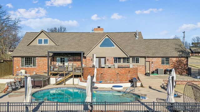 122 Osage Ridge Dr, Sand Springs, OK 74063 - rear view of property with a patio, roof with shingles, a fenced backyard, a hot tub, and brick siding