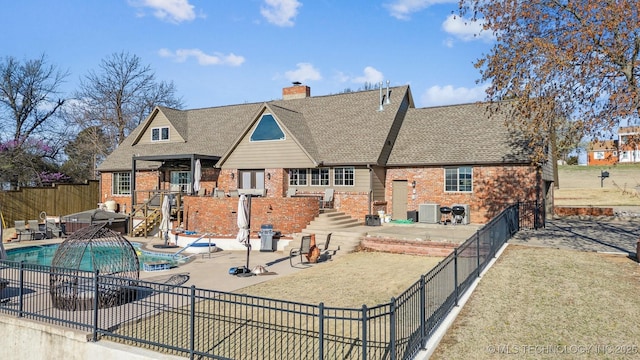 122 Osage Ridge Dr, Sand Springs, OK 74063 - back of house featuring a patio, a fenced backyard, cooling unit, a fenced in pool, and brick siding