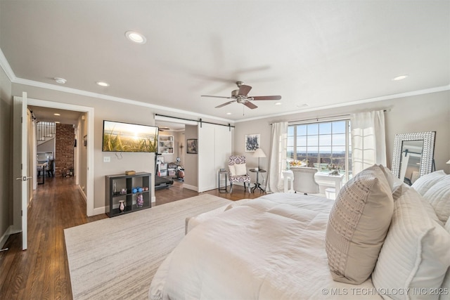 122 Osage Ridge Dr, Sand Springs, OK 74063 - bedroom with dark wood-style floors, baseboards, recessed lighting, ornamental molding, and a barn door