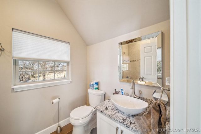 122 Osage Ridge Dr, Sand Springs, OK 74063 - bathroom featuring baseboards, toilet, vanity, and vaulted ceiling