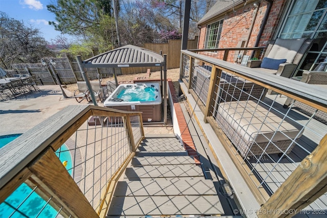 122 Osage Ridge Dr, Sand Springs, OK 74063 - wooden deck featuring a patio, fence, and a hot tub