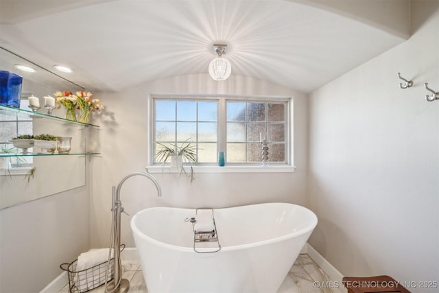 122 Osage Ridge Dr, Sand Springs, OK 74063 - full bathroom with lofted ceiling, a soaking tub, baseboards, and marble finish floor