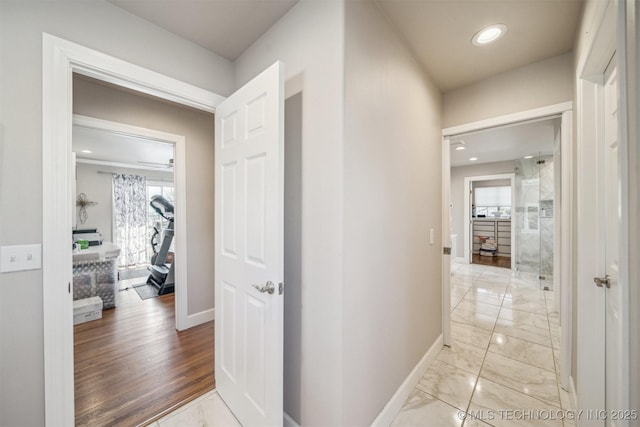 122 Osage Ridge Dr, Sand Springs, OK 74063 - hall featuring baseboards, marble finish floor, and a healthy amount of sunlight
