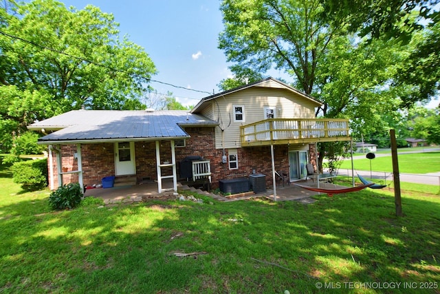 1004 S Owens Ave, Tahlequah, OK 74464 - rear view of property with a lawn, central AC unit, and a patio